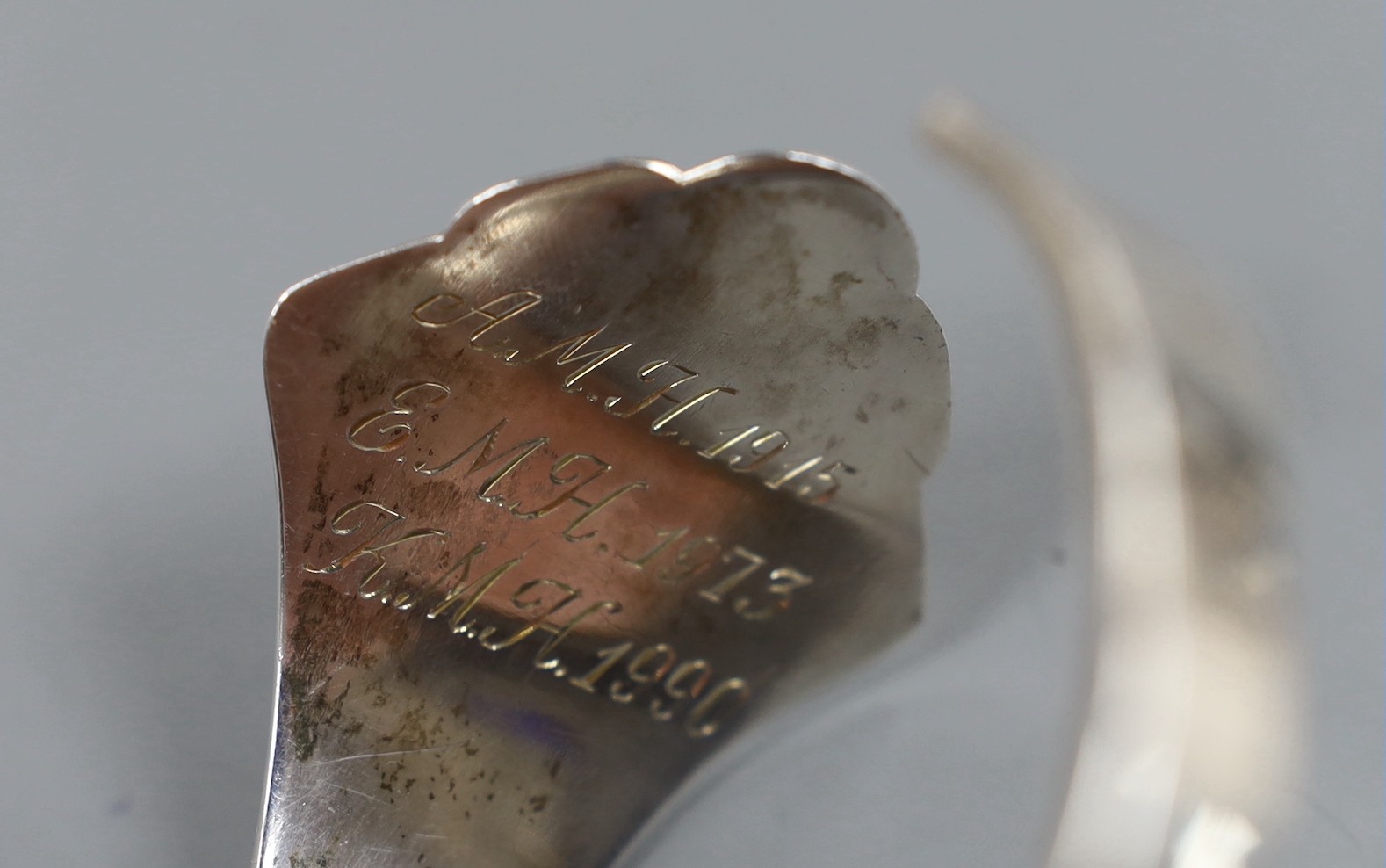 An early 20th century Danish sterling openwork bangle, dated for 1911, with later engraved inscription, assay master Christian F. Heise.